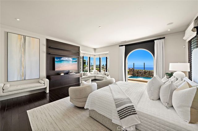 a spacious bedroom with a bed and a couch