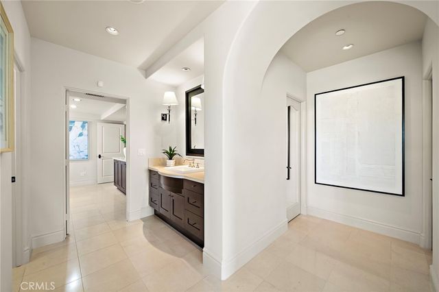 a view of a patio with couches chairs and potted plants
