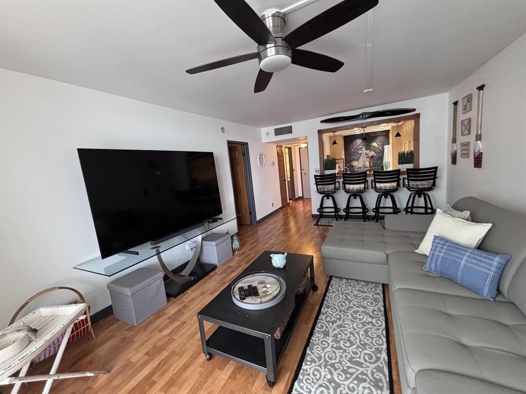 336 North Birch Road, Unit 8D Fort Lauderdale, FL 33304 - Photo 17 of 23 a living room with furniture and a flat screen tv