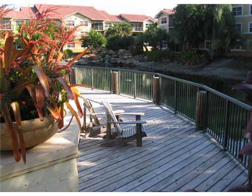 8721 Wiles Road, Unit 302 Coral Springs, FL 33067 - Photo 3 of 4 a view of deck with patio