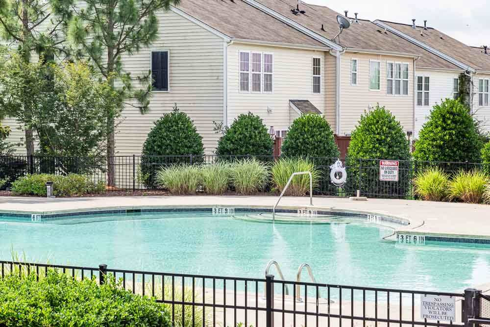 8225 Pilots View Drive Raleigh, NC 27617 - Photo 19 of 20 Just TWO doors away from the pool and directly across from one of 3 entrances, you'll be in the heart of this active, fun community! Community Pool