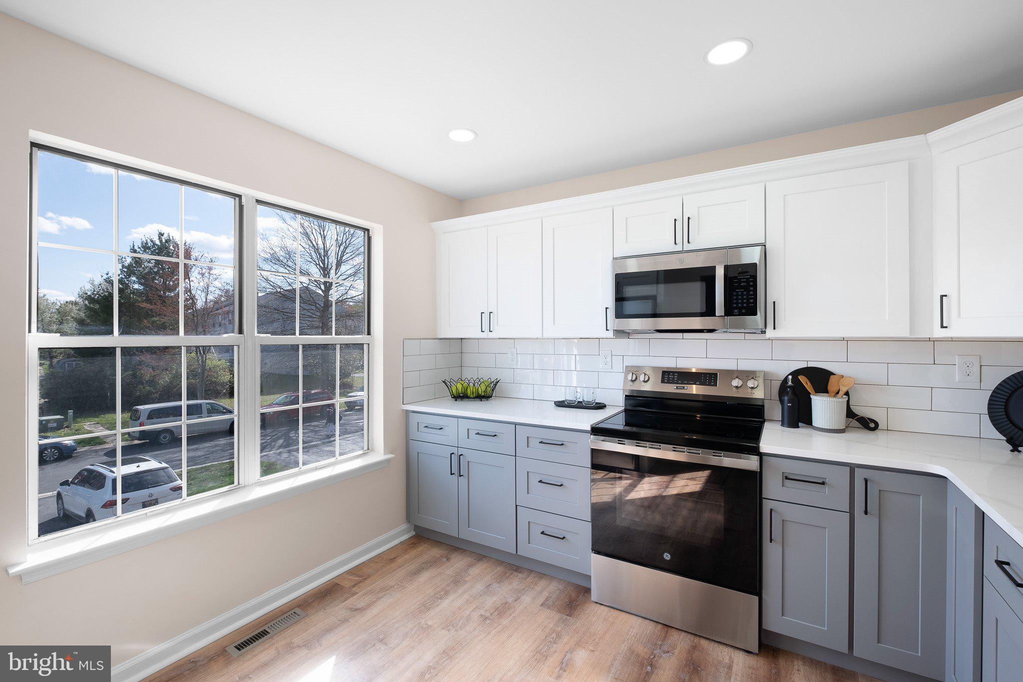 1050 Old Forge Road New Castle, DE 19720 - Photo 11 of 25 a kitchen with a sink a window and appliances
