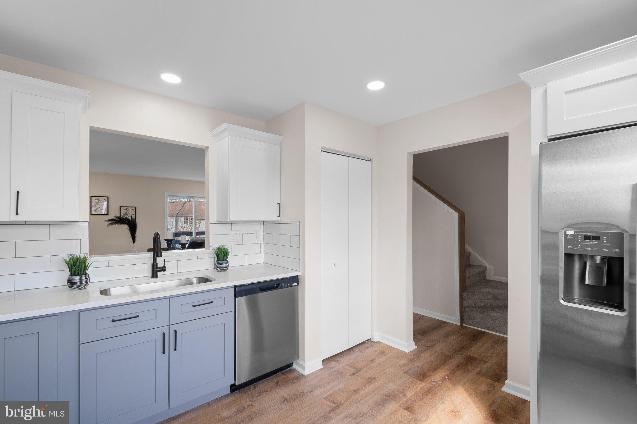 1050 Old Forge Road New Castle, DE 19720 - Photo 12 of 25 a kitchen with a sink and refrigerator