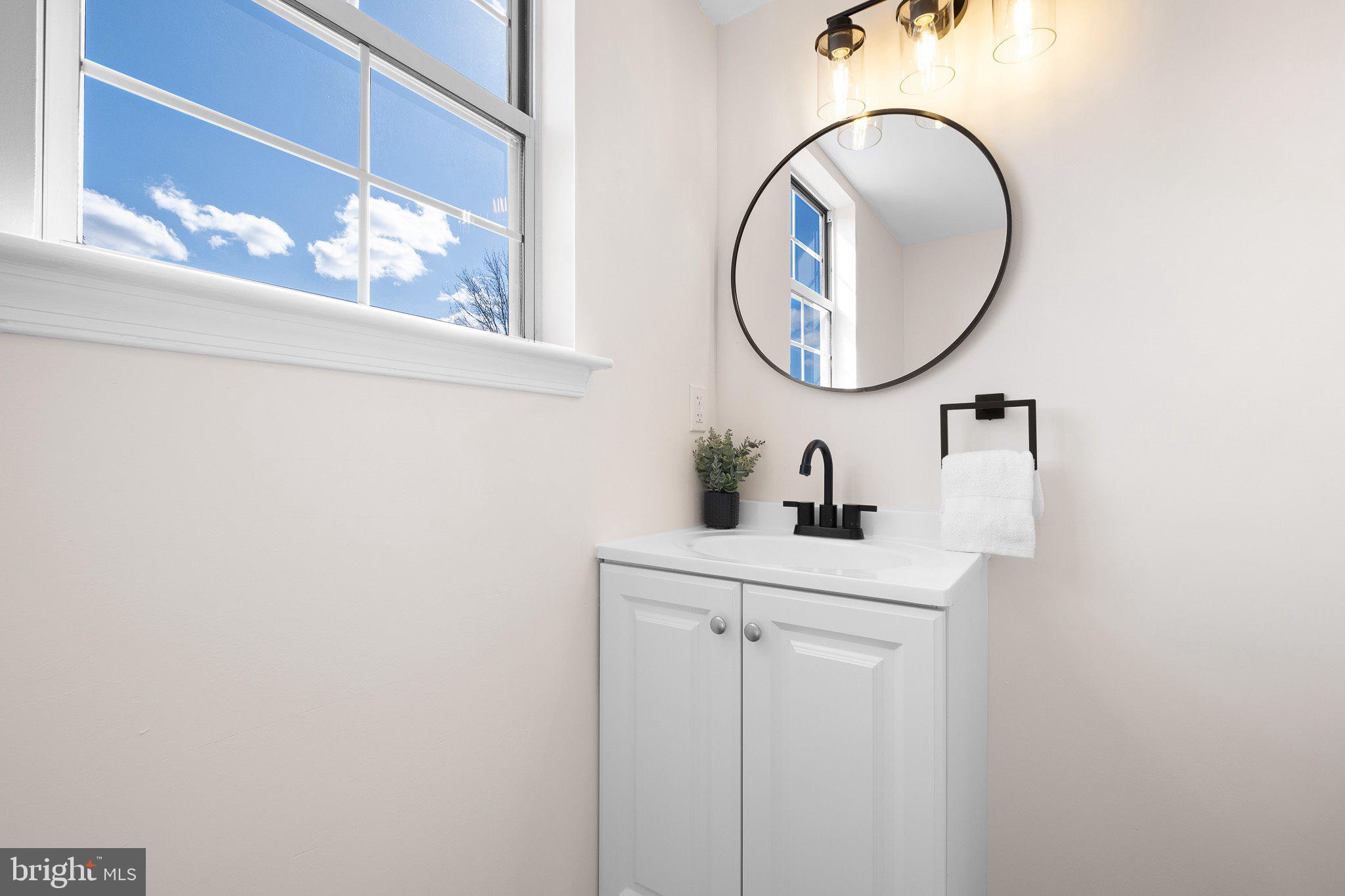 1050 Old Forge Road New Castle, DE 19720 - Photo 15 of 25 a bathroom with a sink mirror and vanity
