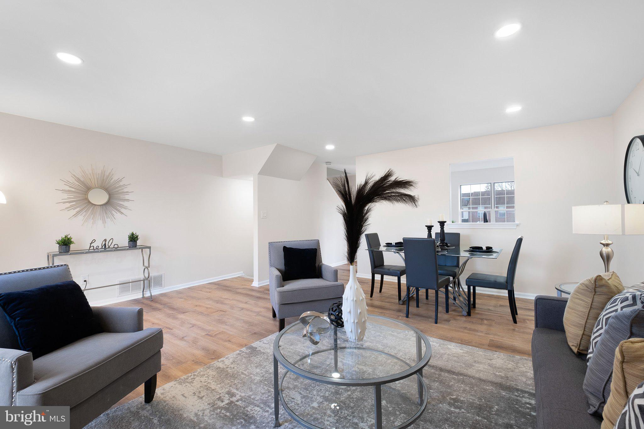 1050 Old Forge Road New Castle, DE 19720 - Photo 3 of 25 a living room with furniture potted plant and a table