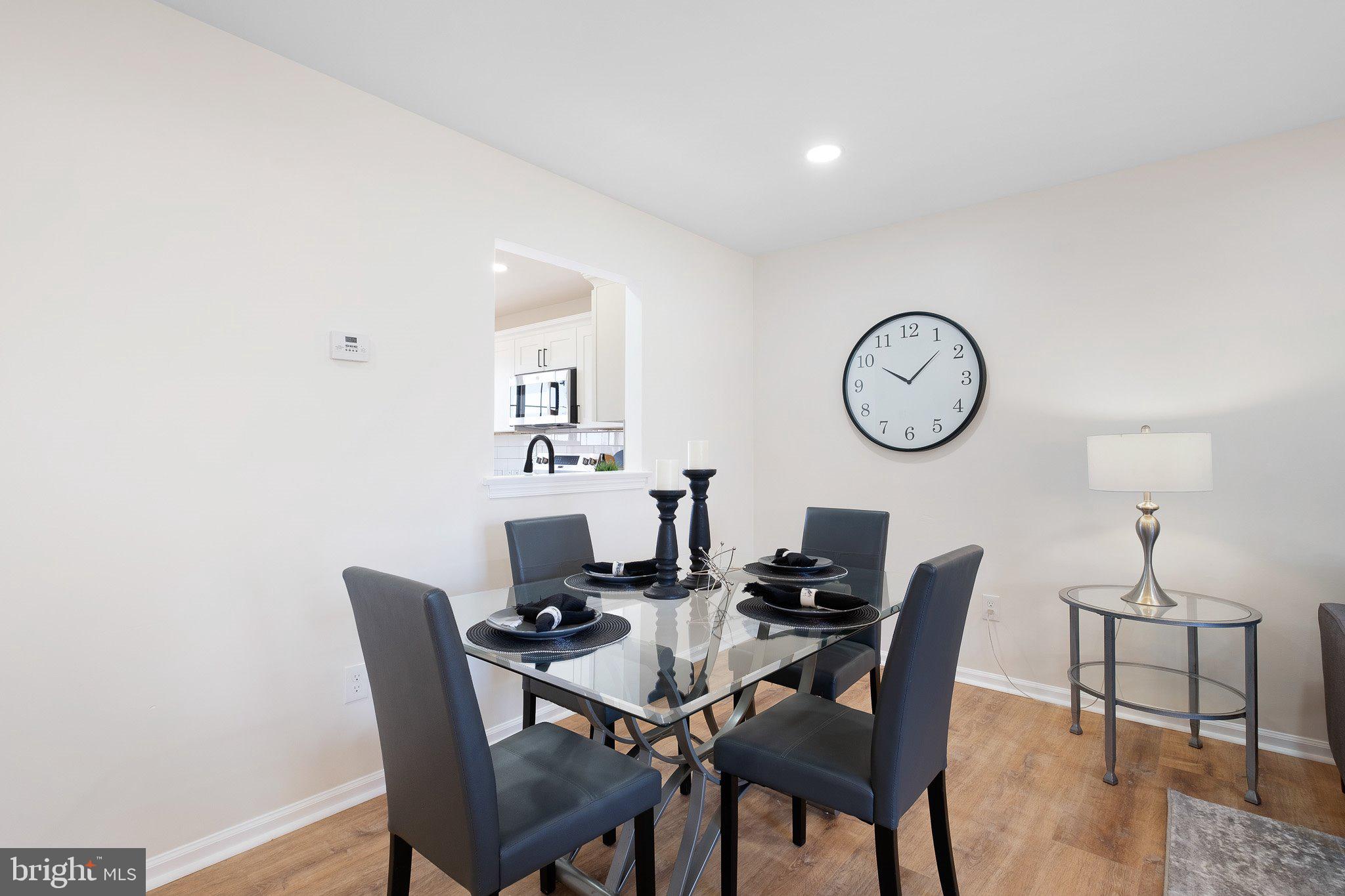 1050 Old Forge Road New Castle, DE 19720 - Photo 9 of 25 a view of a dining room with furniture and a chandelier