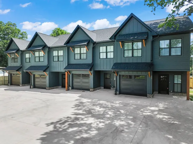 a front view of a house with yard