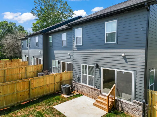 a view of a house with a chairs in patio