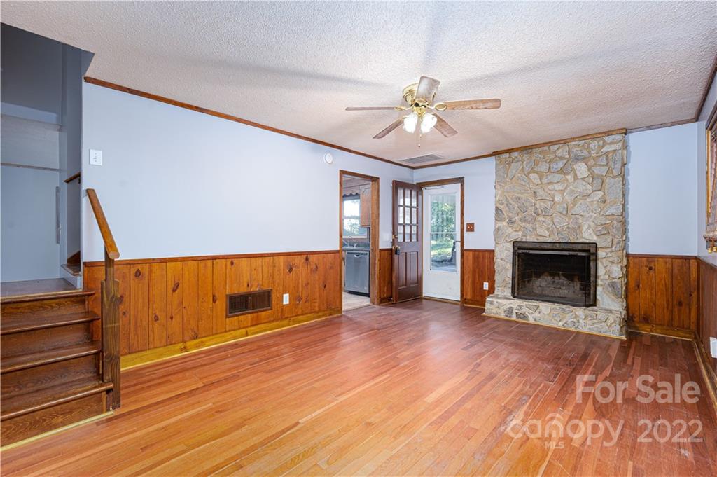 1990 Cat Square Road Vale, NC 28168 - Photo 3 of 37 a view of an empty room with wooden floor fireplace and a window