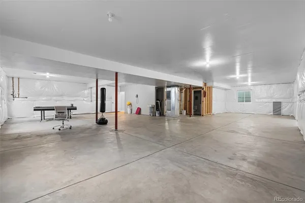 a view of a livingroom with workspace and a couch
