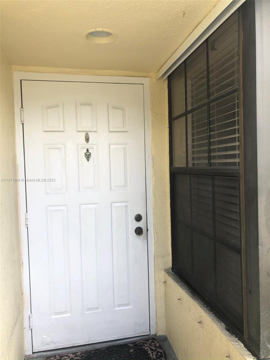 12902 Southwest 88th Terrace, Unit B201 Miami, FL 33186 - Photo 3 of 49 a view of front door