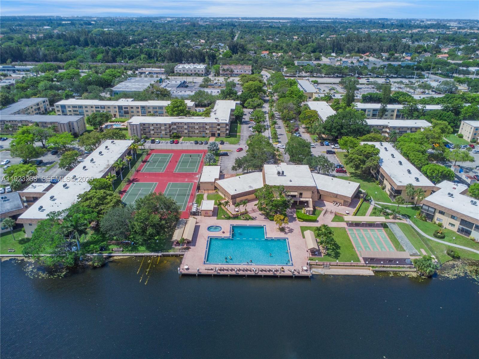 534 Briarwood Circle, Unit 148 Hollywood, FL 33024 - Photo 39 of 40 an aerial view of residential houses with outdoor space and parking