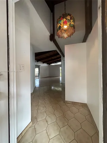 a view of an empty room with glass door