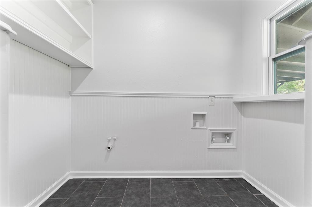 2405 Monroe Street Commerce, TX 75428 - Photo 27 of 31 a view of a room with racks on the wall