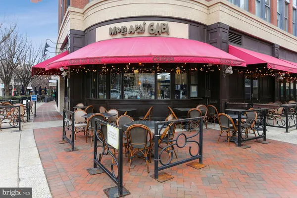 a view of a cafe with sitting area