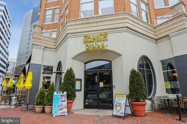 a view of a building with potted plants