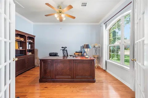a view of workspace with furniture and window