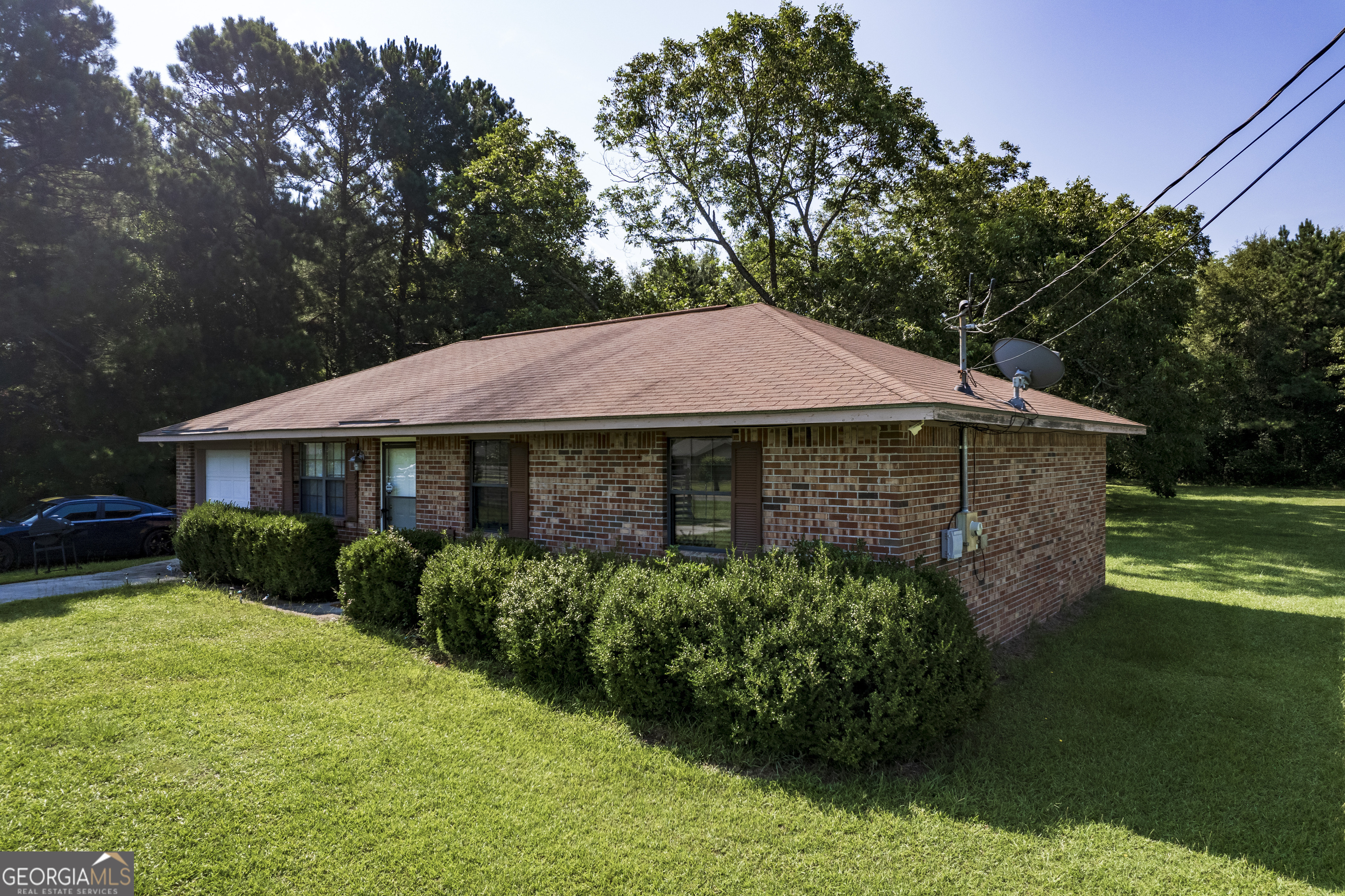 735 River Road Fort Valley, GA 31030 - Photo 2 of 10 a view of a house with garden and trees