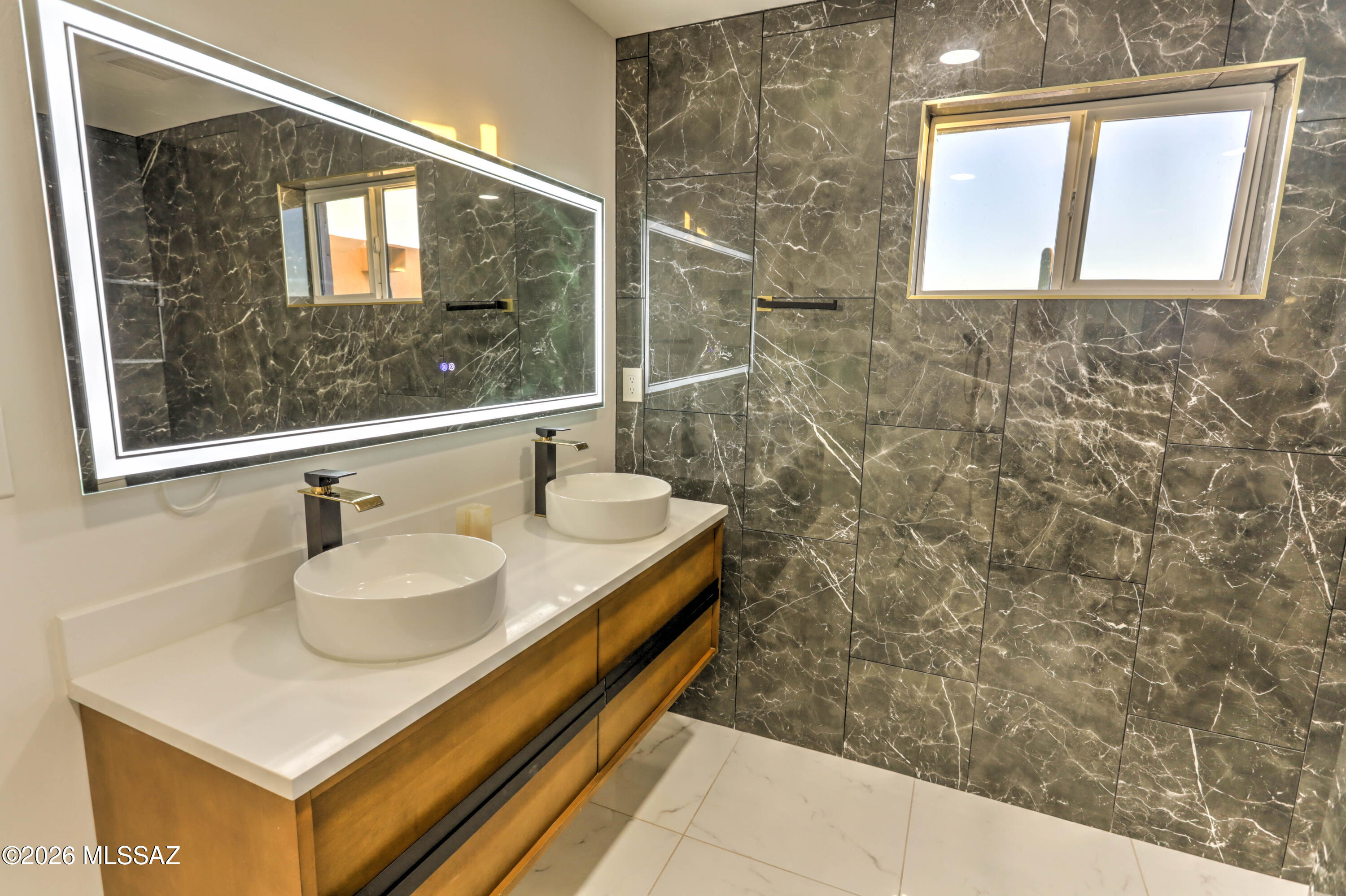 4939 East River Road Tucson, AZ 85718 - Photo 13 of 29 a bathroom with a sink and a mirror