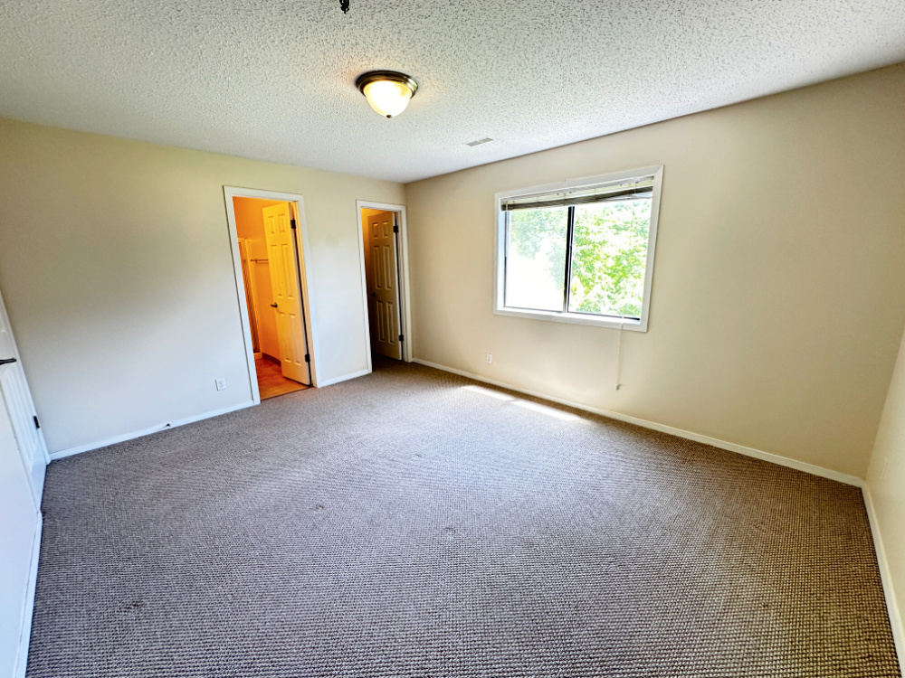 1340 Brook Street, Unit F St. Charles, IL 60174 - Photo 5 of 10 a view of an empty room with a window