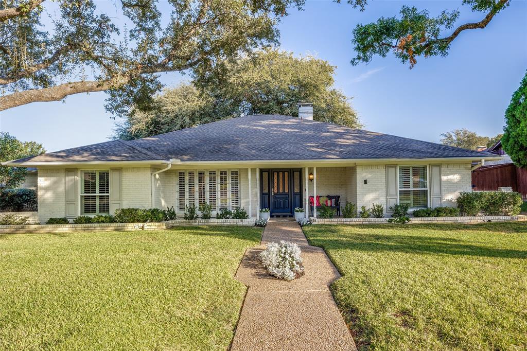 a front view of a house with swimming pool and furniture