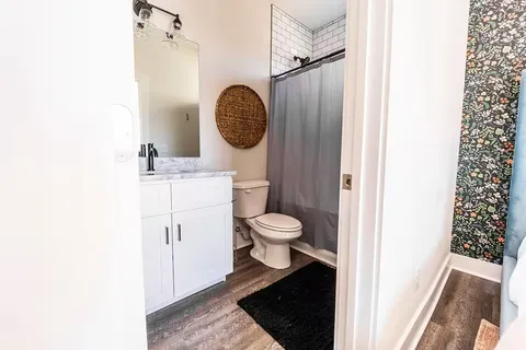 a bedroom with a large bed and a window