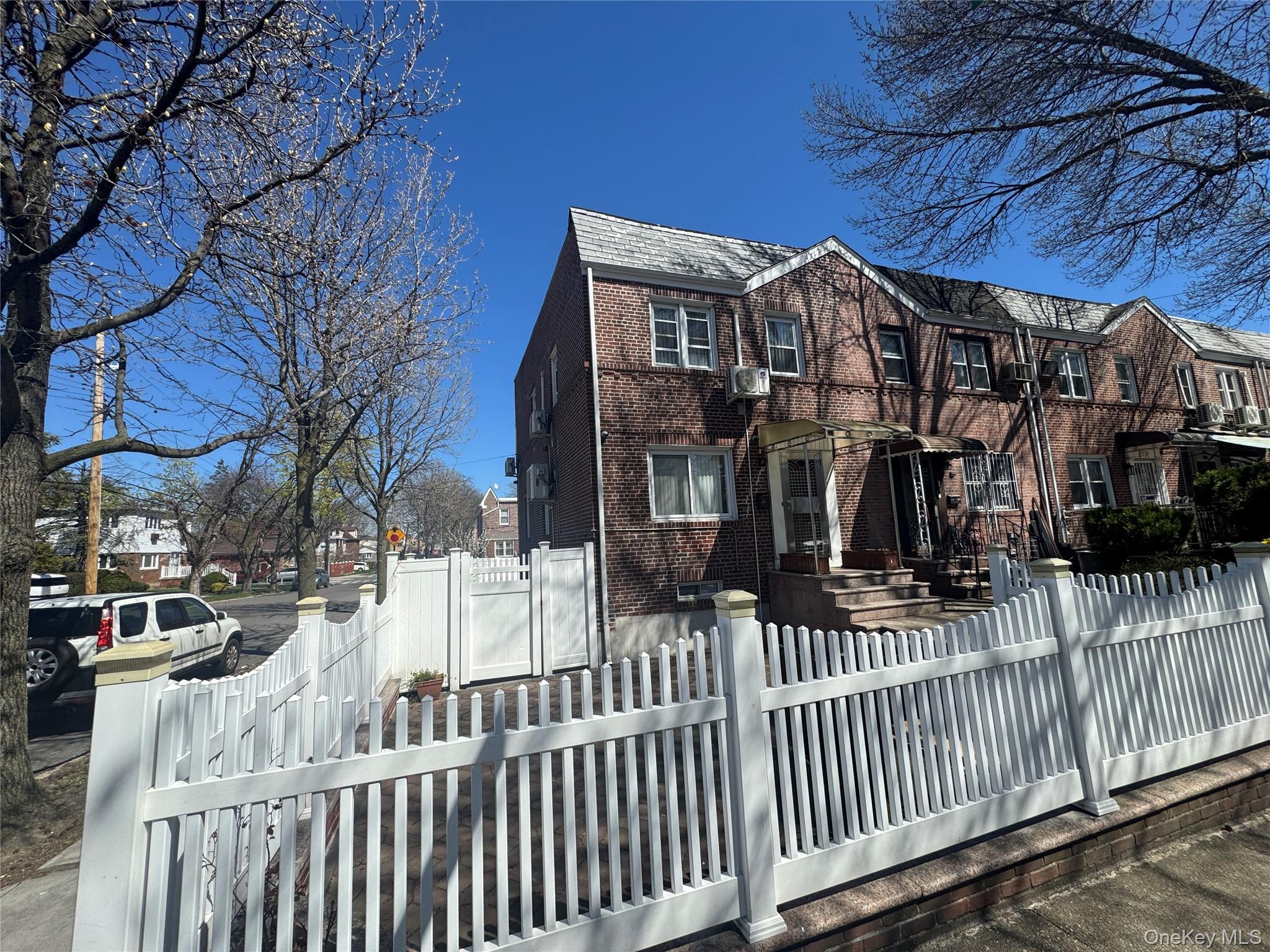 75-01 167th Street Queens, NY 11366 - Photo 1 of 10 a view of a house with a small yard