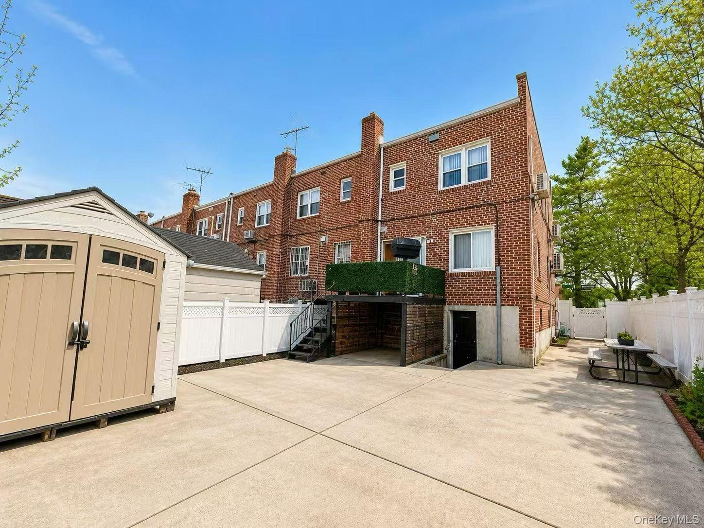 75-01 167th Street Queens, NY 11366 - Photo 2 of 10 a view of a house with a backyard