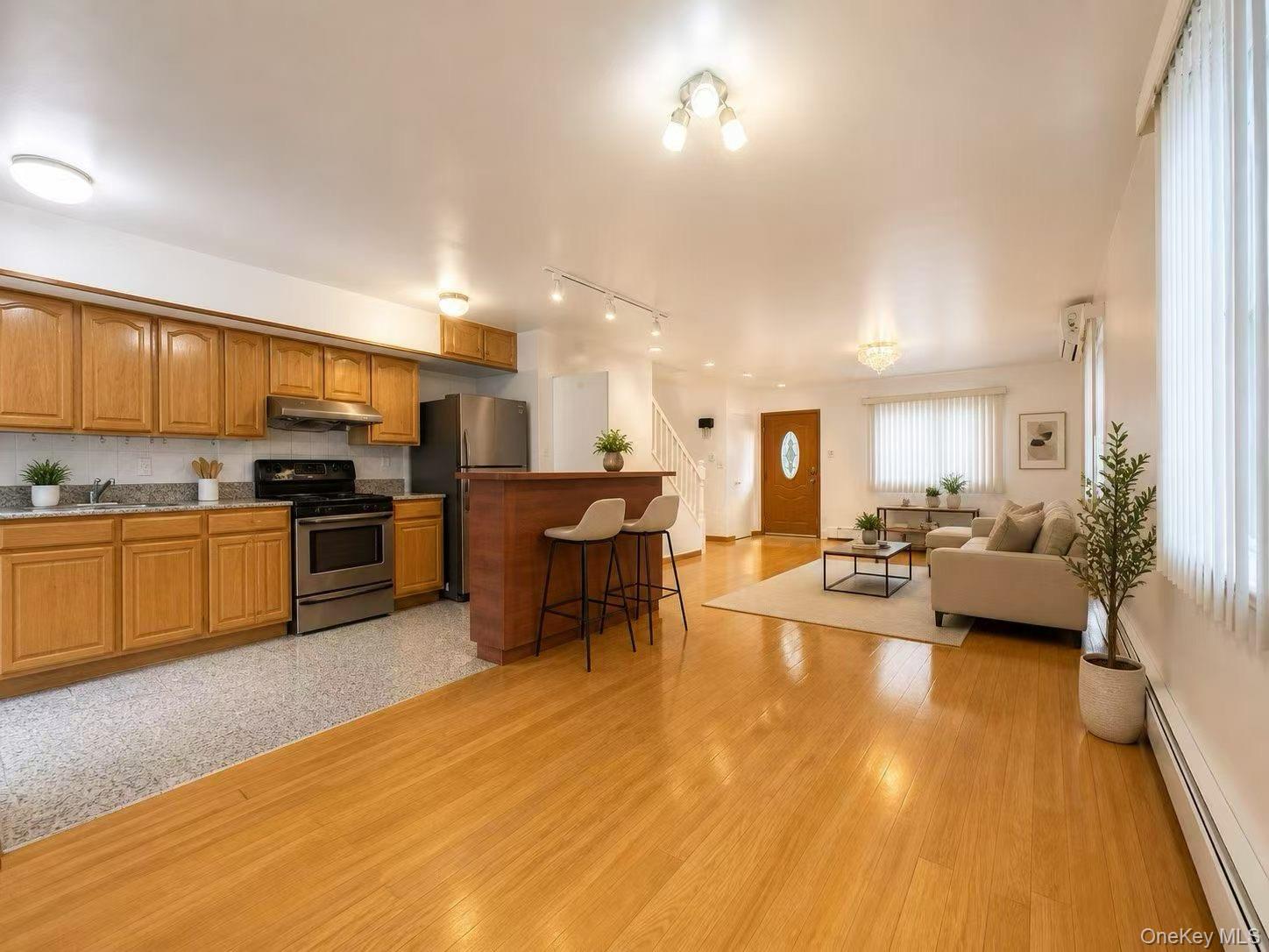 75-01 167th Street Queens, NY 11366 - Photo 4 of 10 a kitchen with a sink and appliances