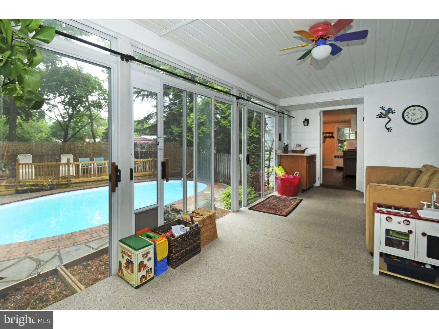 7708 Oak Lane Road Cheltenham, PA 19012 - Photo 17 of 32 Glass enclosed Sun Room with sliders to pool area