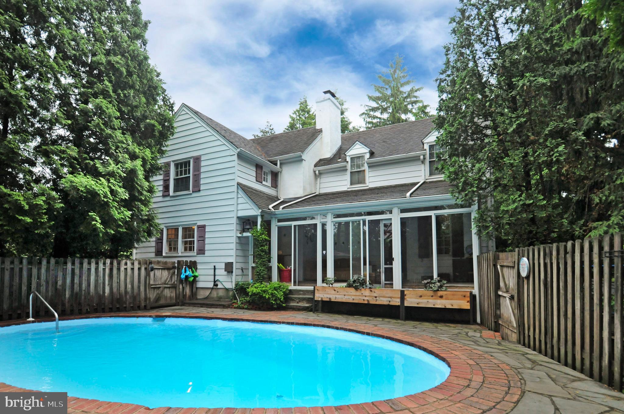 7708 Oak Lane Road Cheltenham, PA 19012 - Photo 22 of 32 View from pool to glass sunroom