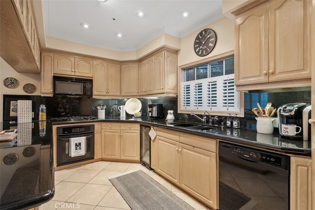 315 Old Ranch Road Sierra Madre, CA 91024 - Photo 14 of 42 a kitchen with stainless steel appliances granite countertop a stove a sink and a microwave