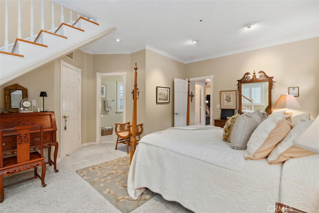 315 Old Ranch Road Sierra Madre, CA 91024 - Photo 19 of 42 a bedroom with a bed a table and chair