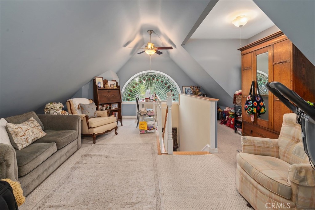 315 Old Ranch Road Sierra Madre, CA 91024 - Photo 21 of 42 a living room with furniture a fireplace and a chandelier