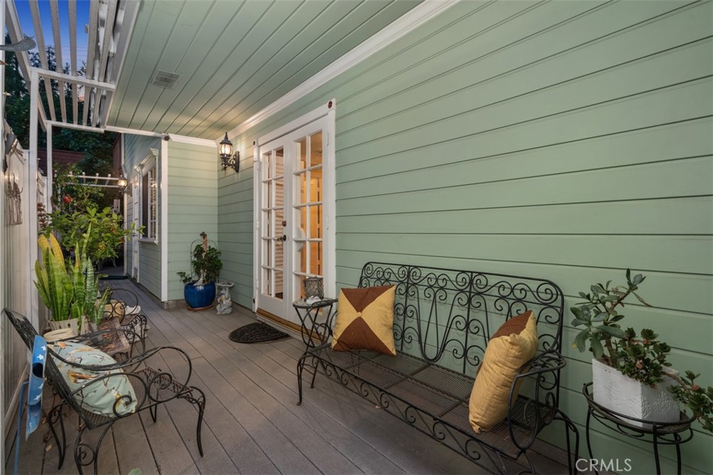 315 Old Ranch Road Sierra Madre, CA 91024 - Photo 31 of 42 a roof deck with couches and potted plants with wooden floor