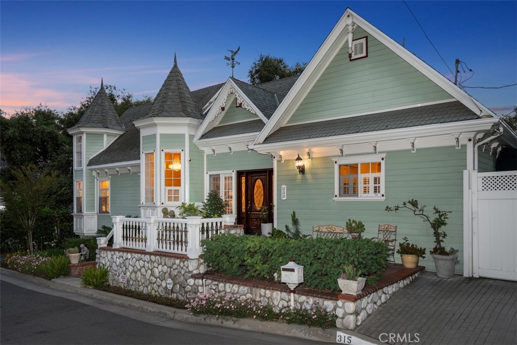 315 Old Ranch Road Sierra Madre, CA 91024 - Photo 37 of 42 a front view of a house with garden