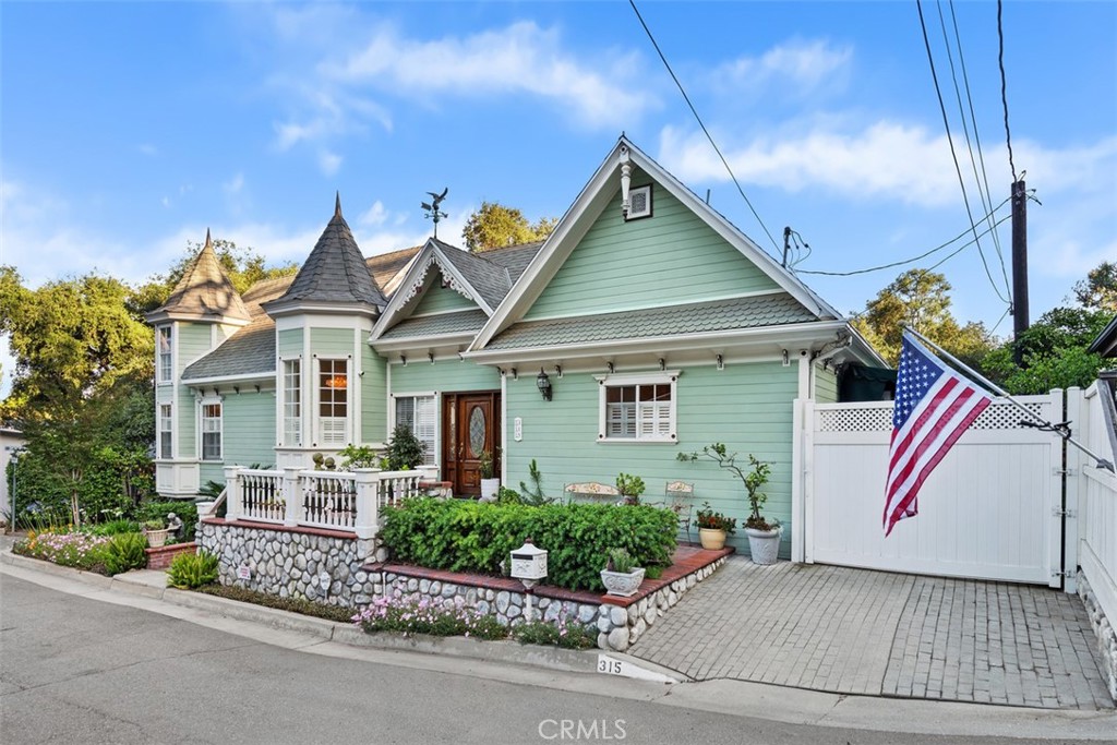 315 Old Ranch Road Sierra Madre, CA 91024 - Photo 5 of 42 a front view of a house with a garden