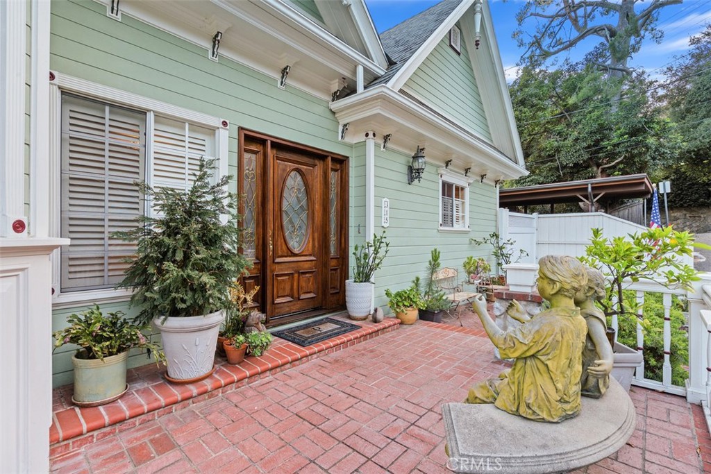 315 Old Ranch Road Sierra Madre, CA 91024 - Photo 7 of 42 a front view of a house with outdoor seating