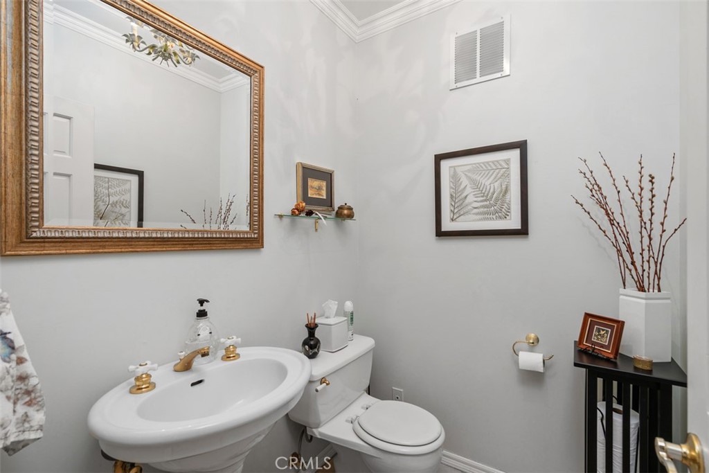 315 Old Ranch Road Sierra Madre, CA 91024 - Photo 10 of 42 a bathroom with a toilet a sink and mirror