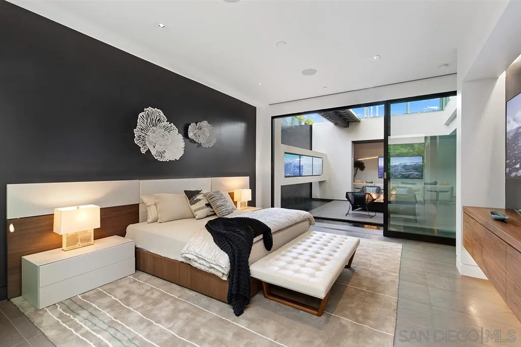 311 Sea Ridge Drive La Jolla, CA 92037 - Photo 20 of 25 a bedroom with a bed and wooden floor