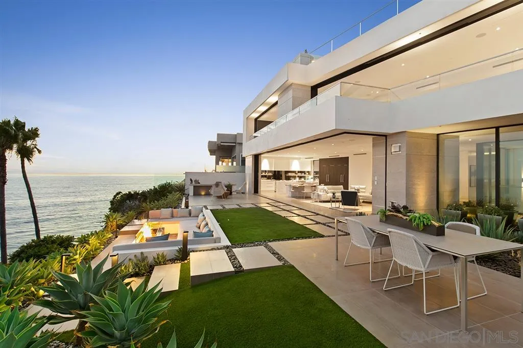 311 Sea Ridge Drive La Jolla, CA 92037 - Photo 6 of 25 a view of a swimming pool with chairs and floor to ceiling window