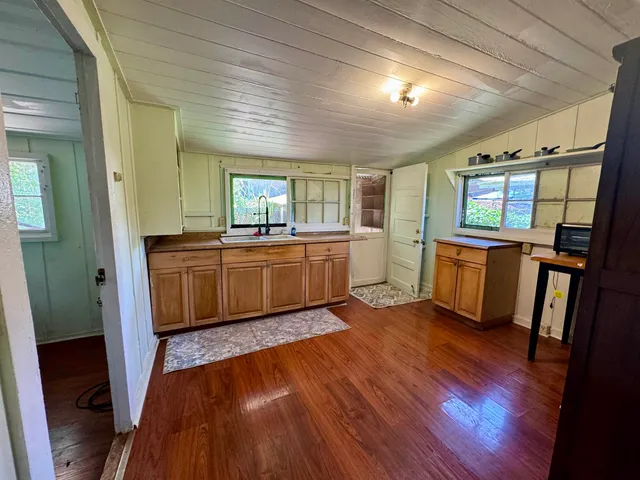 a view of a hardwood floor in a room