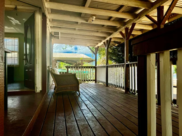 a view of a balcony with wooden floor