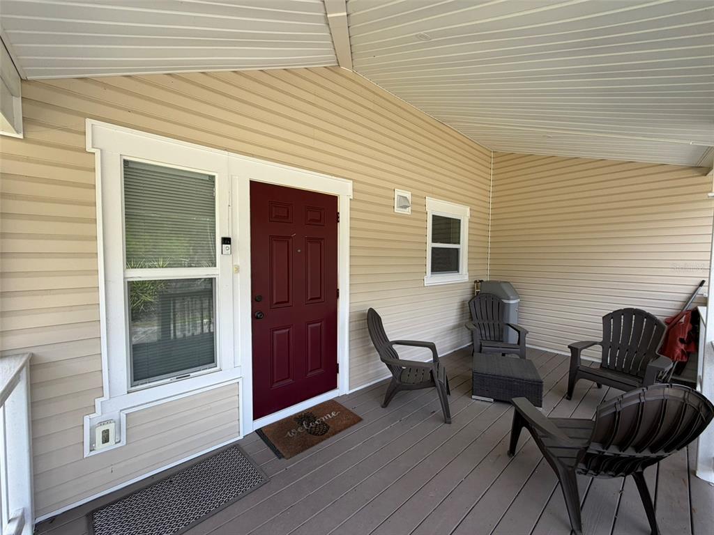 903 East New York Avenue DeLand, FL 32724 - Photo 28 of 29 a backyard of a house with barbeque oven table and chairs