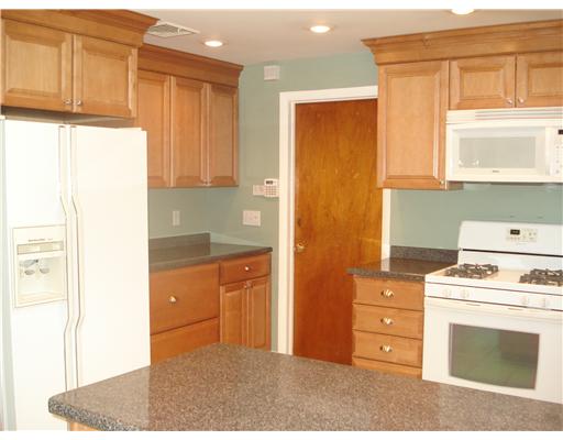 40 Vega Drive Warwick, RI 02886 - Photo 3 of 8 Kitchen. New kitchen and appliances opens to dining area with sliders to rear yard
