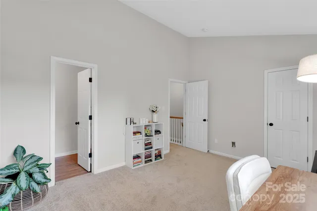 a view of a bedroom with a bed and toys