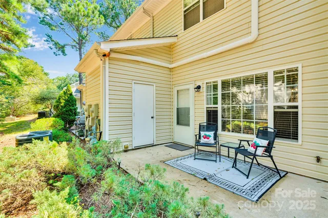 a house view with a sitting space and garden