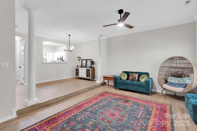 a living room with furniture and a rug