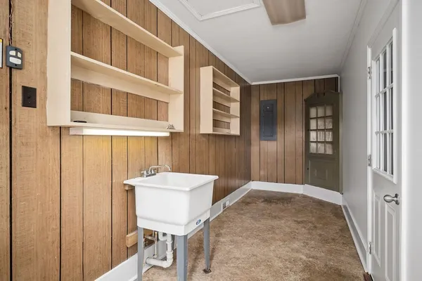 a view of a hallway with seating area