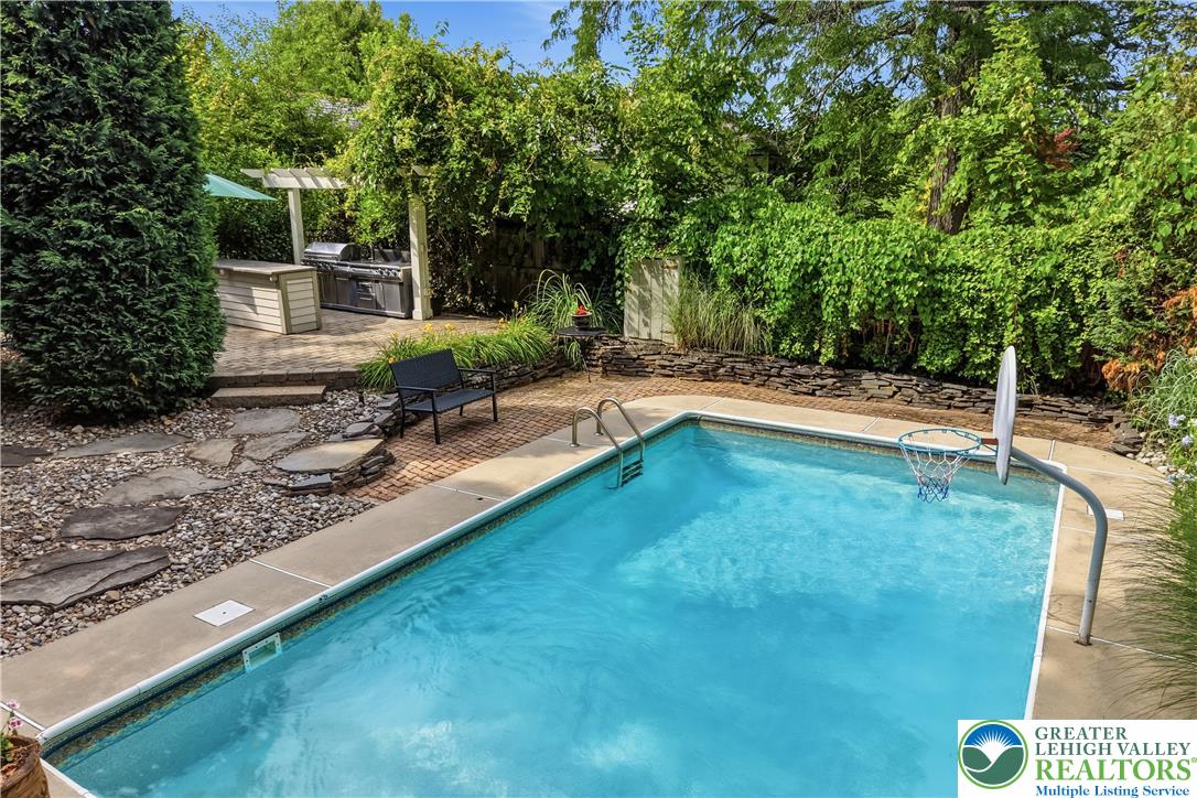 2014 Linden Street Bethlehem, PA 18017 - Photo 55 of 85 An inviting private pool and outdoor kitchen area create a perfect backyard oasis.